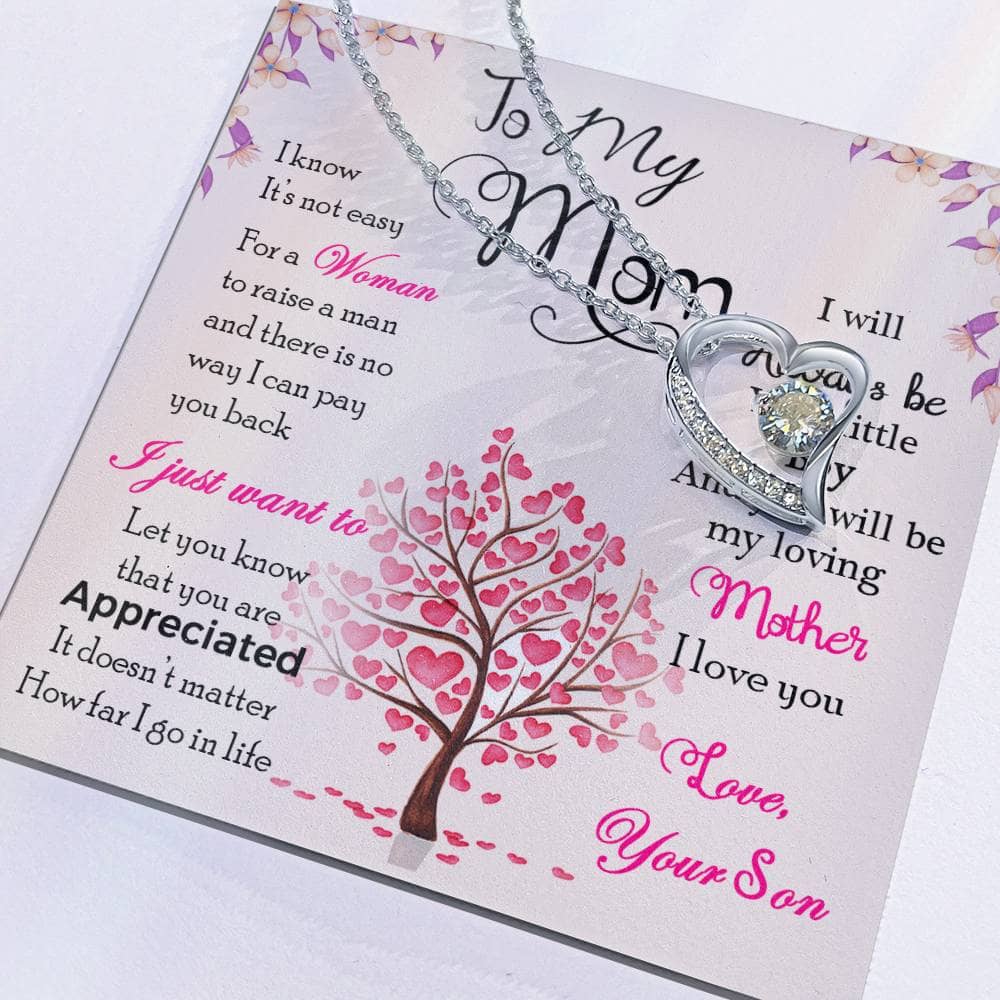 Alt text: "Enduring Love Personalized Mother Necklace From Child - A heart-shaped pendant necklace on a card, featuring a radiant cushion-cut cubic zirconia, symbolizing the unending love between a mother and her child."