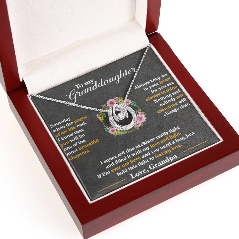 Alt text: "Personalized Granddaughter Necklace - Silver pendant with heart-shaped cubic zirconia on adjustable chain in mahogany-style box"