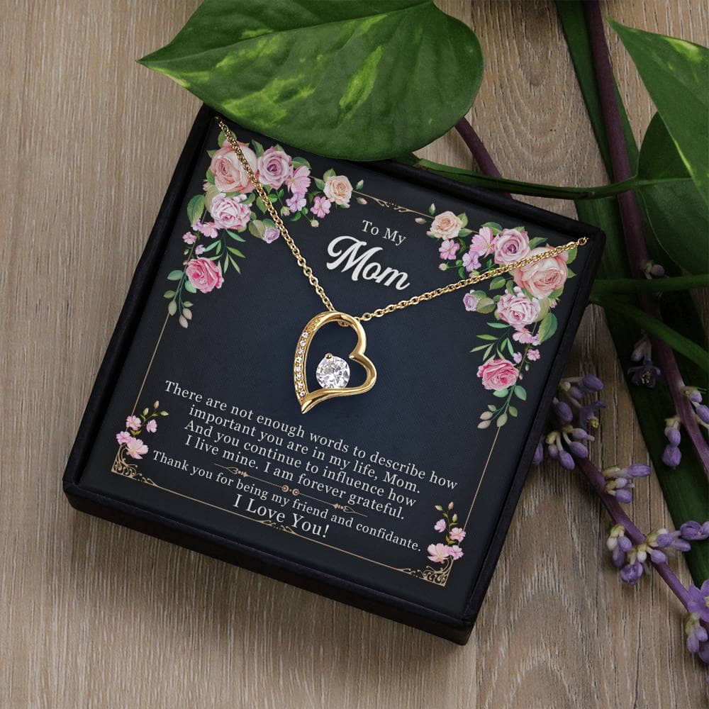 Alt text: "Personalized Mother Necklace - Forever Love Pendant Gift: Necklace in a box with flowers and leaves"