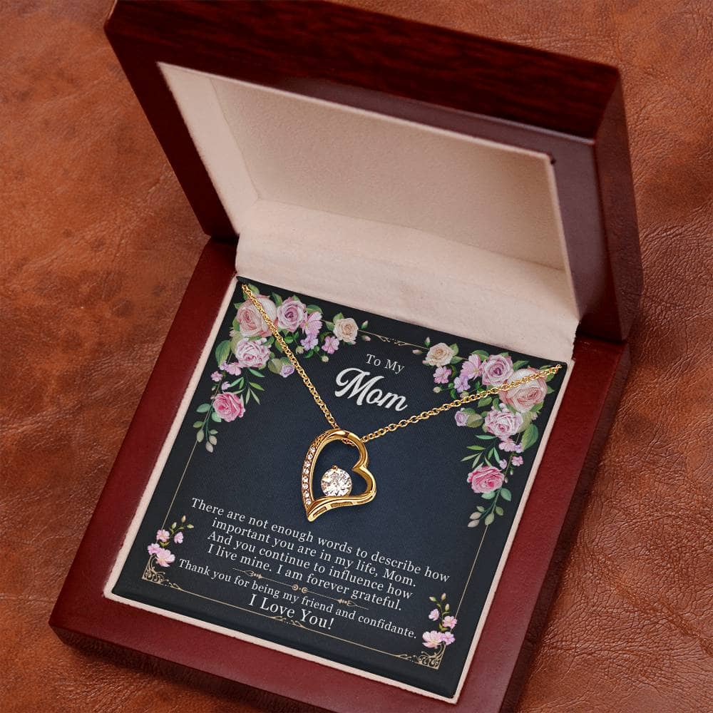 Alt text: "Wooden box with heart-shaped pendant necklace inside"
