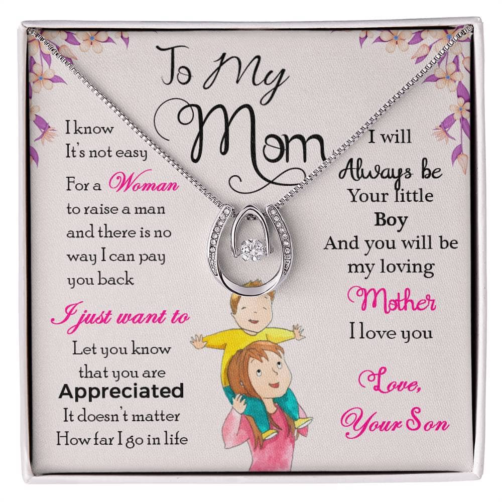 A necklace in a box, symbolizing the cherished bond between a mother and child. Crafted with superior-grade materials and adorned with a cushion-cut cubic zirconia pendant. Adjustable cable chain and box chain options. Packaged in a lavish mahogany-style box with LED lighting. Ideal gift for any occasion.