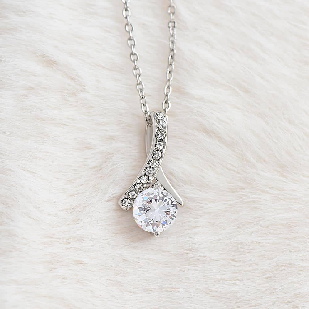 Alt text: "Close-up of a personalized Soulmate Necklace with diamond pendant on a chain"