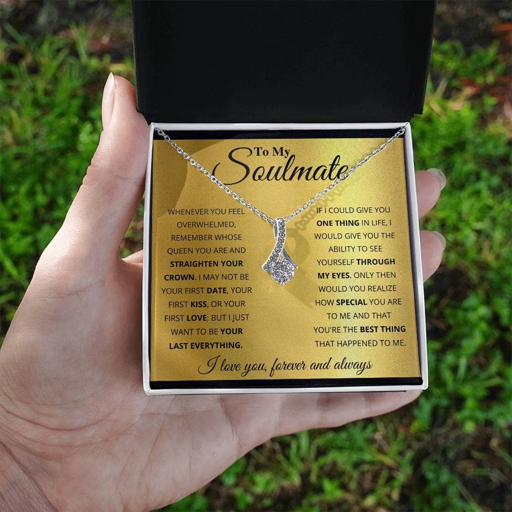 A hand holding a Personalized Soulmate Necklace in a luxurious box with LED lighting, symbolizing deep connection and eternal love.