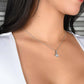 Alt text: "A woman wearing a personalized Soulmate Necklace, adorned with a cushion-cut cubic zirconia pendant. Symbolizing deep connection and eternal love, this luxurious necklace is available in 14K white gold or 18K gold finish. Customize with interlocking hearts or a love knot design. Perfect for special occasions or as a heartfelt gift. Packaged in a mahogany-style box with LED lighting. Celebrate your unique love story with this Alluring Beauty Necklace."