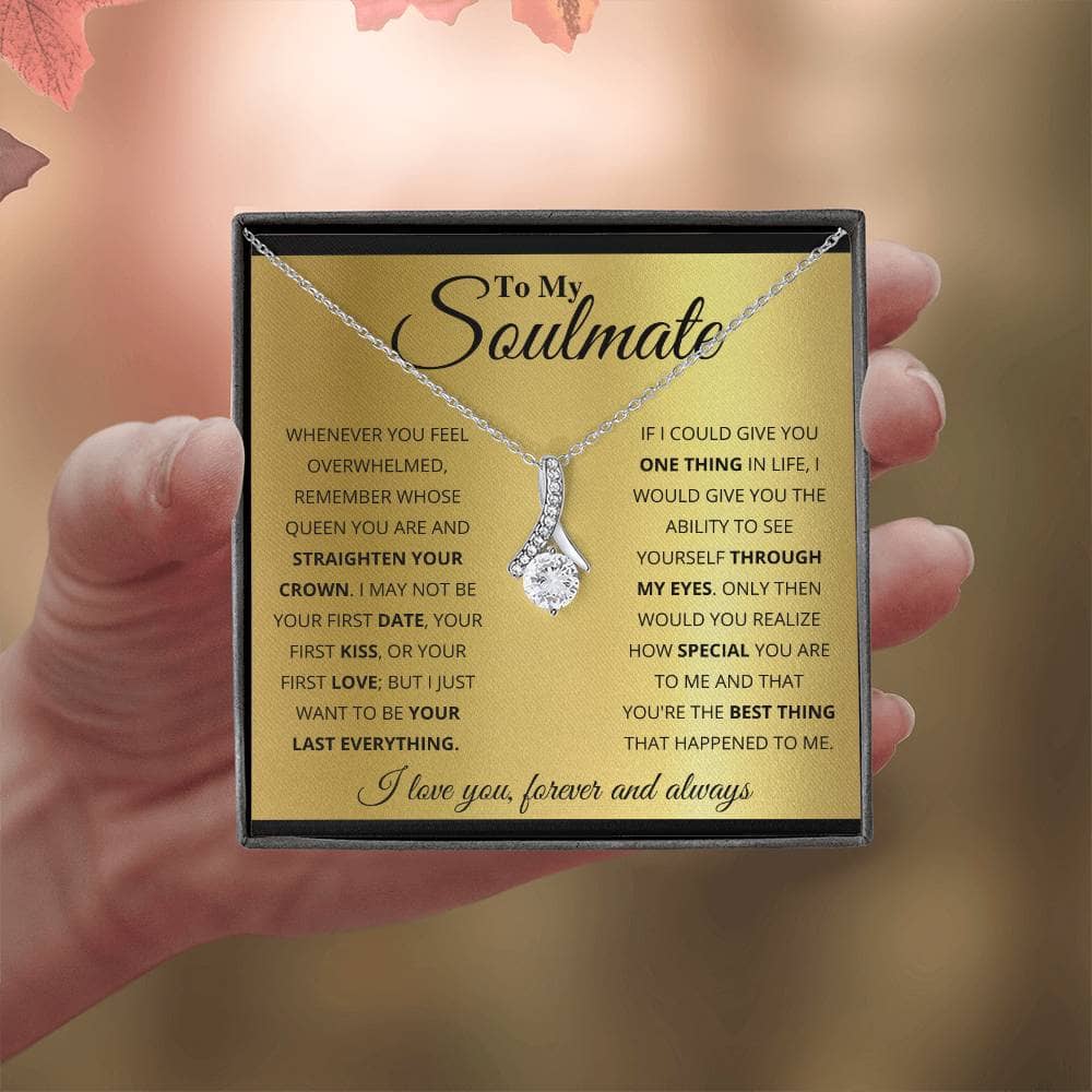 Alt text: "Hand holding a Personalized Soulmate Necklace with diamond pendant, symbolizing deep connection and eternal love."