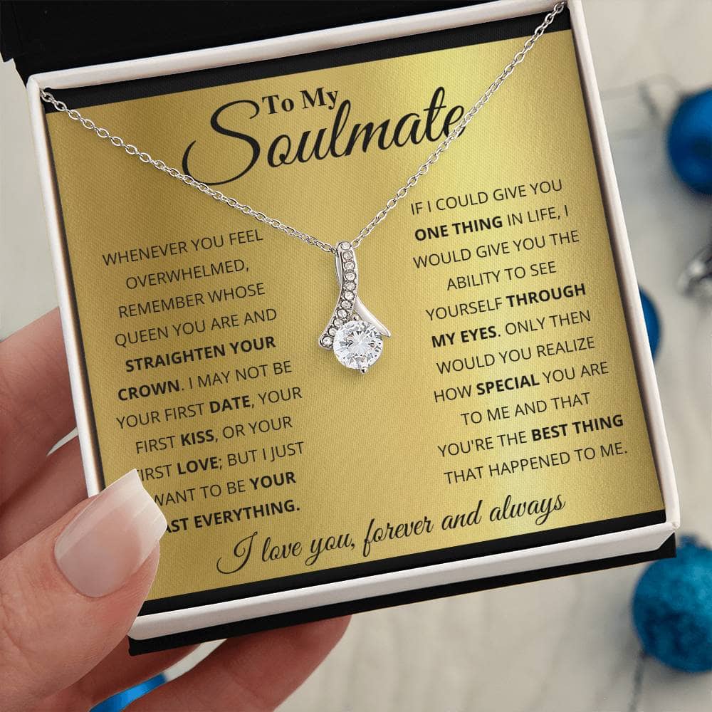 Alt text: "Hand holding a Personalized Soulmate Necklace, adorned with cubic zirconia, symbolizing deep connection and eternal love."