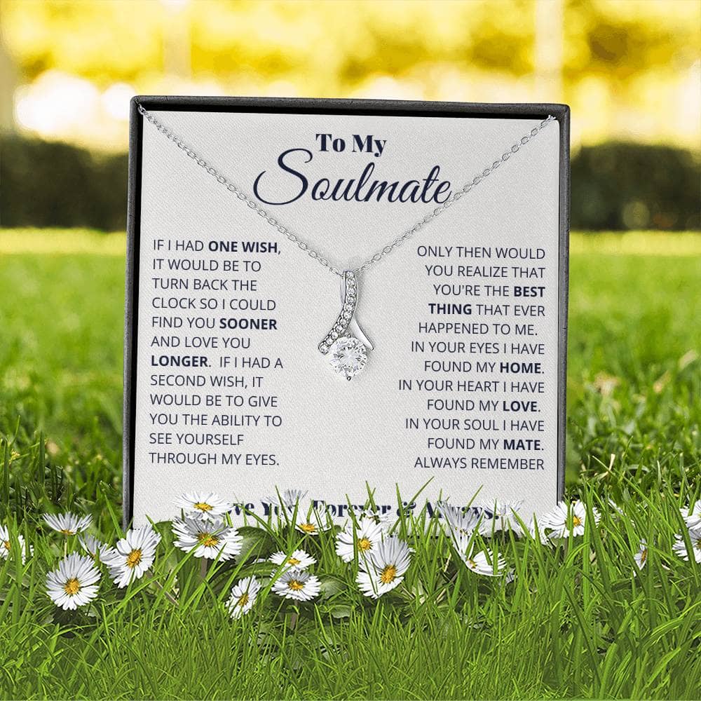 Alt text: "Personalized Soulmate Necklace in a box with flowers"