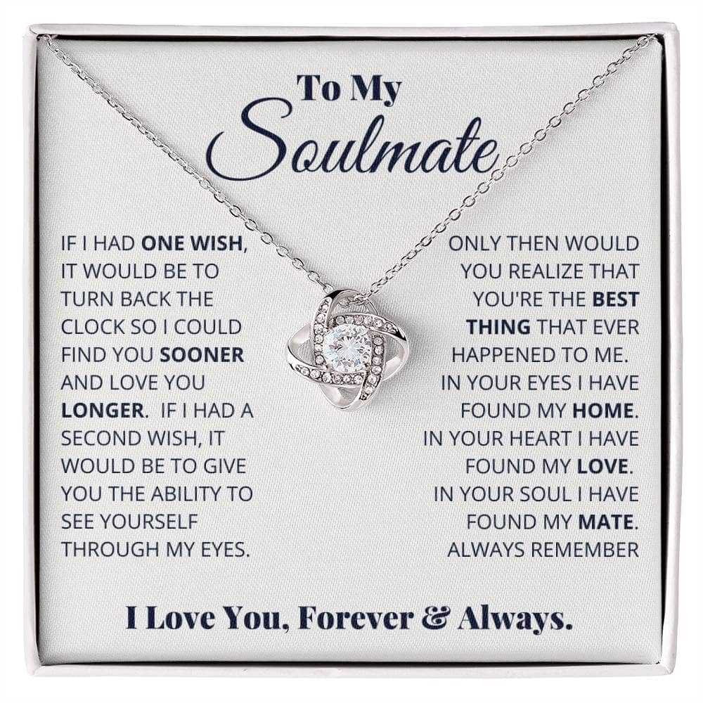 Alt text: "Close-up of Always & Forever Love Knot Soulmate Necklace in a box, featuring interlocking hearts design and 6mm cubic zirconia stone pendant."