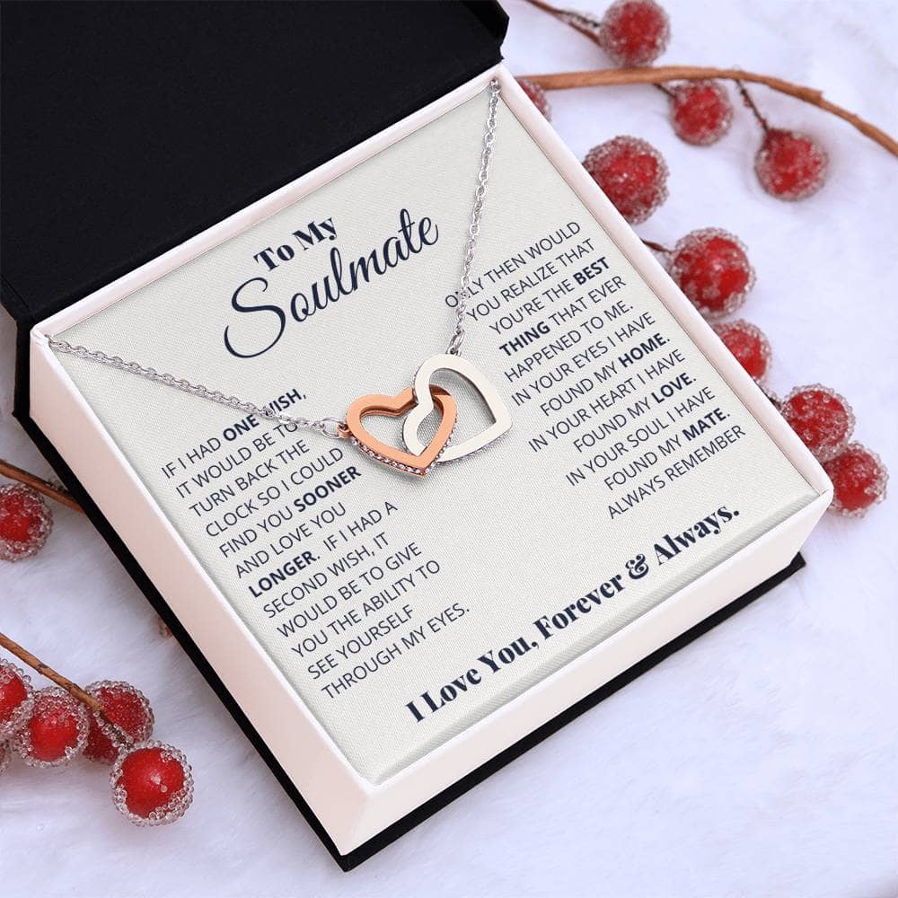 Alt text: "Beloved Soulmate Interlocking Hearts Necklace in a luxurious box with red berries"