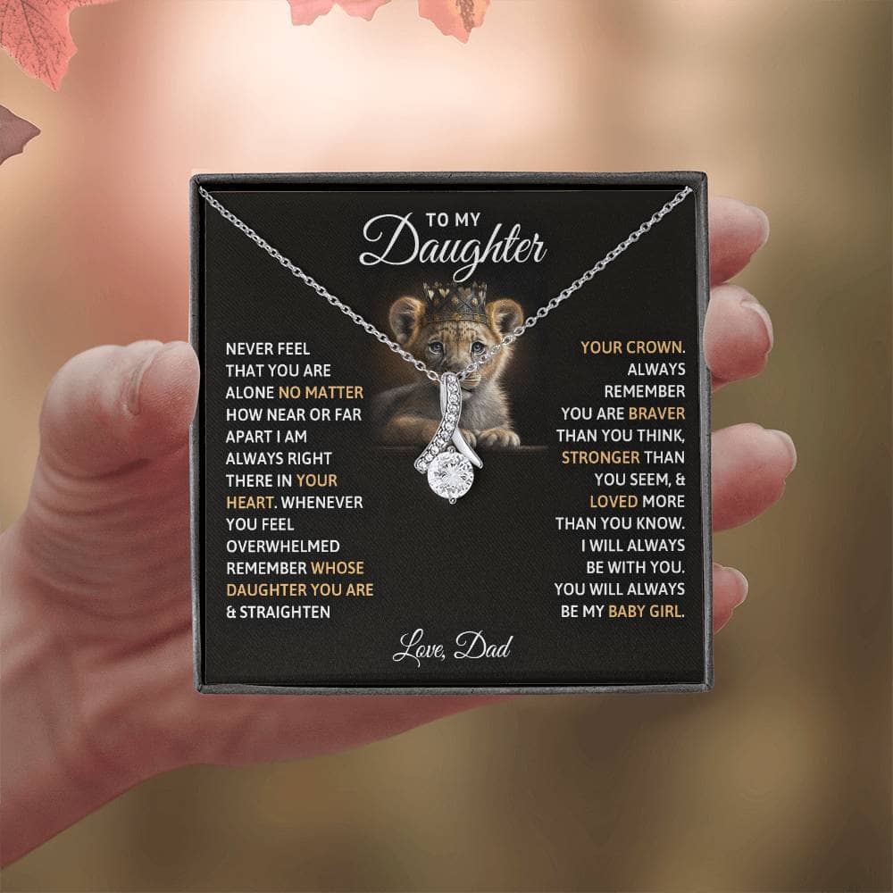 Alt text: "Hand holding Cherished Bond Personalized Daughter Necklace with lion cub pendant"