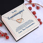 Alt text: "Cherished Bond Personalized Granddaughter Necklace in a luxury box with LED lighting"