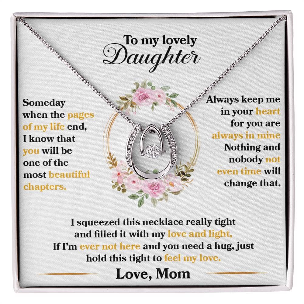 Alt text: "Cherished Moments Personalized Daughter Necklace in a box, featuring a heart-shaped pendant with cubic zirconia. Adjustable chain options. Luxurious mahogany-style packaging with LED lights."