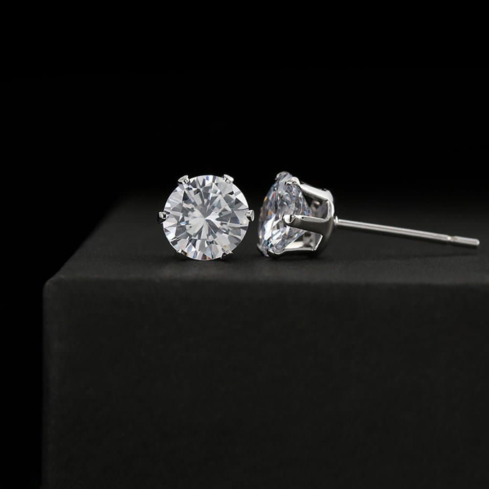 A pair of brilliant Cubic Zirconia Earrings, 6mm sparkling studs in 18K white gold over stainless steel. Elevate your style with these timeless accessories.