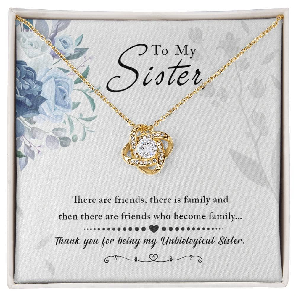 A close-up image of the Personalized Unbiological Sisters Necklace, featuring a diamond pendant in the shape of a love knot. The necklace is elegantly crafted in 14k white gold or 18k gold finish and adorned with cushion-cut cubic zirconia. It comes in a sophisticated mahogany-style box with LED lighting for a memorable unboxing experience. Perfect for heartfelt occasions between sisters, this necklace celebrates the bond of sisterhood.