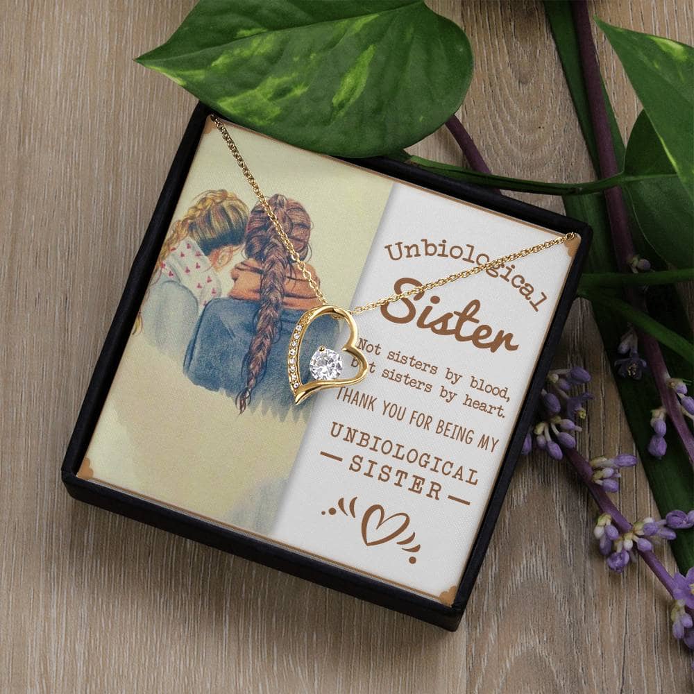 Alt text: Custom-made Sisters By Heart Cubic Zirconia Necklace in a mahogany-style box with LED lighting, symbolizing unbreakable bonds of sisterhood.