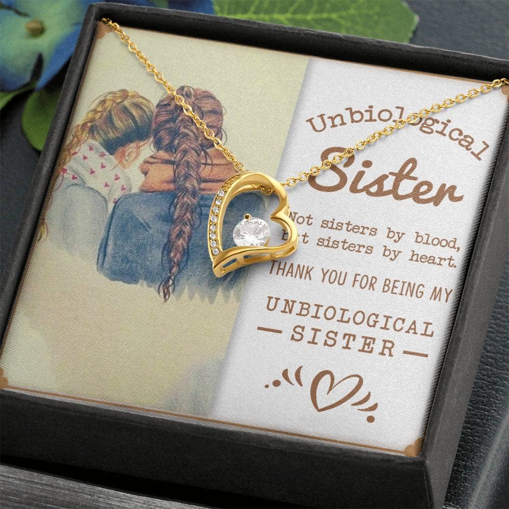 Alt text: "Custom-made Sisters By Heart Cubic Zirconia Necklace in a mahogany-style box with LED lighting, symbolizing unbreakable bonds of sisterhood and friendship."