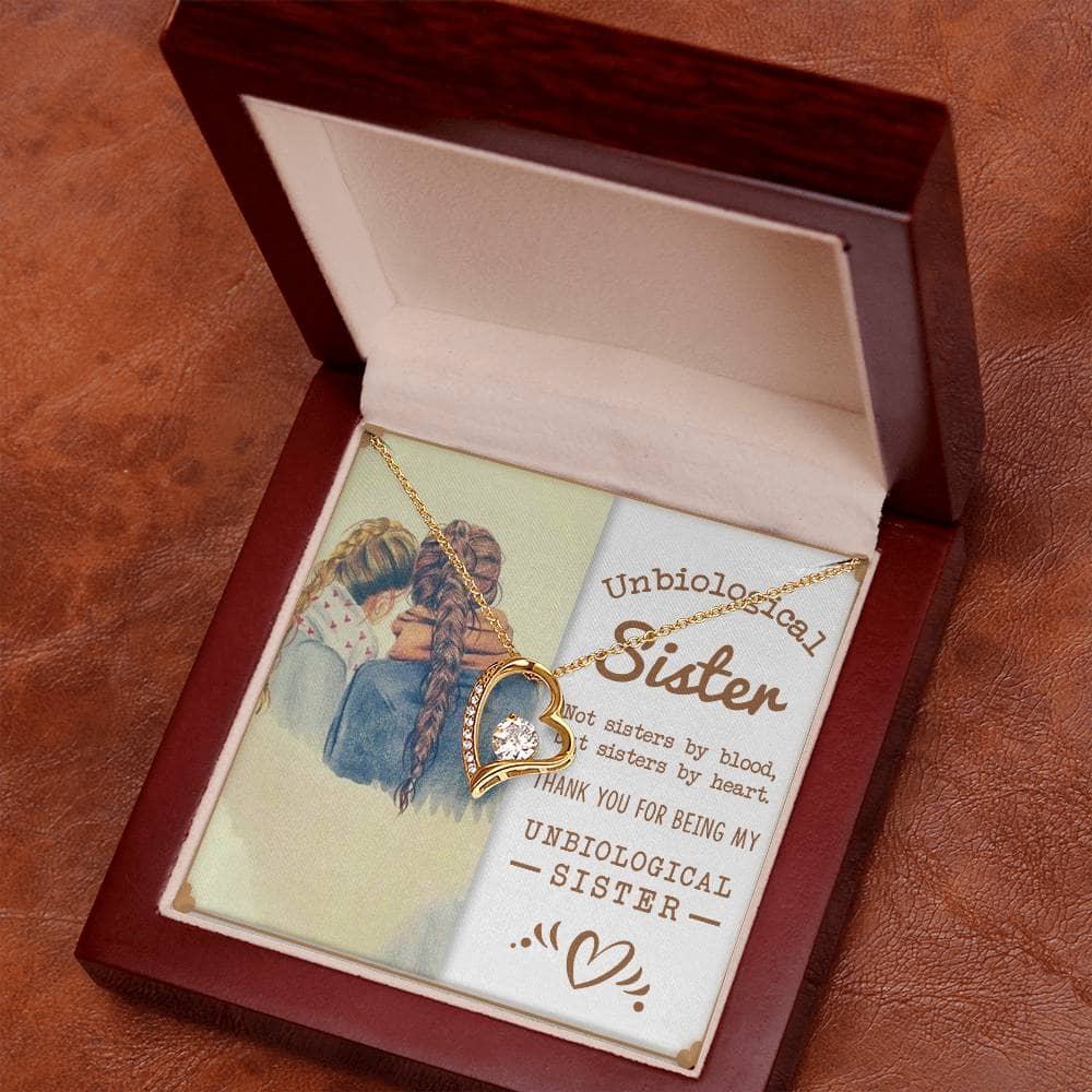 Alt text: "Custom-made Sisters By Heart Cubic Zirconia Necklace in a box with two girls and a gold necklace."