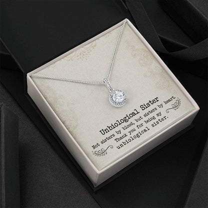 Alt text: "Personalized Unbiological Sisters Necklace in a box - symbol of sisterhood and love, with interlocking heart pendant and adjustable chain."