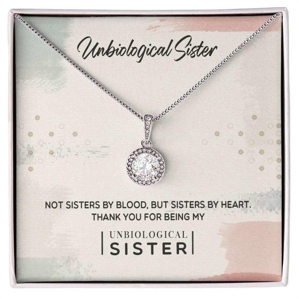 Alt text: "Custom Unbiological Sisters Commemorative Necklace in box with diamond pendant"