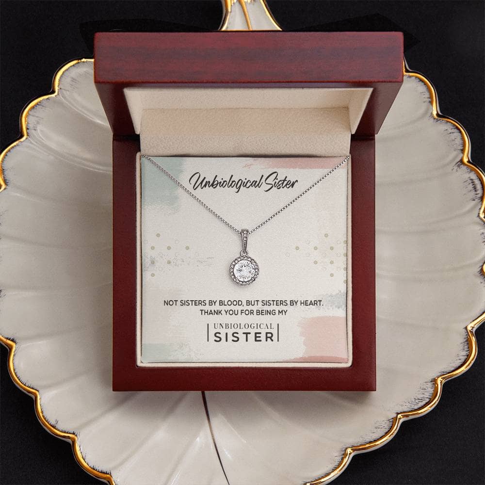 Alt text: "Custom Unbiological Sisters Commemorative Necklace: Necklace in box with pendant, symbolizing unbreakable bond and love. 14k/18k gold, cubic zirconia."