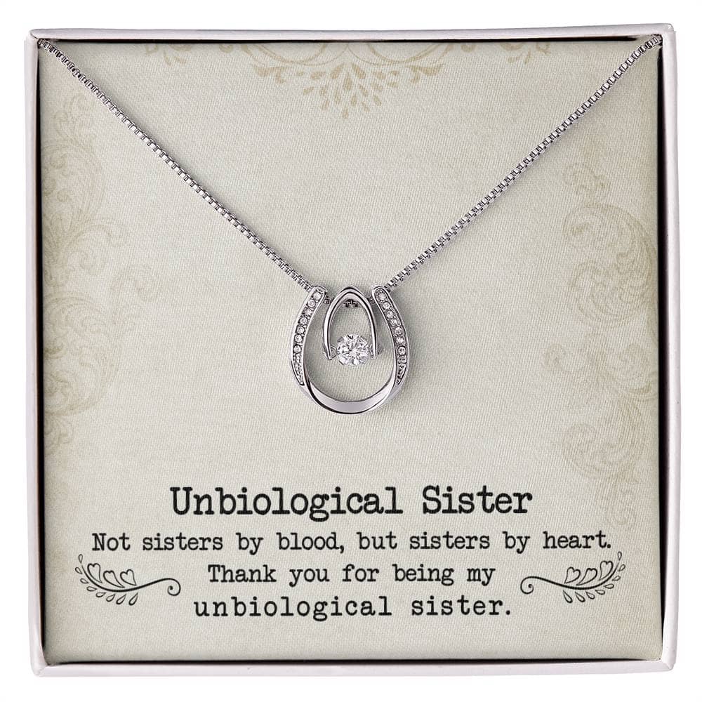 A necklace in a box with a diamond pendant, symbolizing the unbiological bond between sisters. Crafted with top-tier quality, available in 14k white gold or 18k gold finish. Adjustable cable or box chains offer a customizable fit. Elevate the gifting experience with an exquisite mahogany-style box with LED lighting. Cherish the shared bond with this Personalized Unbiological Sisters Necklace.