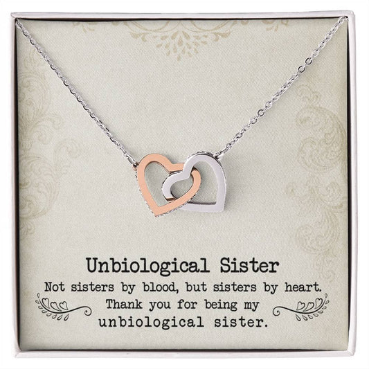 Alt text: "Custom Unbiological Sisters Necklace with Heart Pendant in a box, symbolizing eternal sisterhood and bonds, available in 14k white gold or 18k gold finishes, adorned with luminescent cubic zirconia."