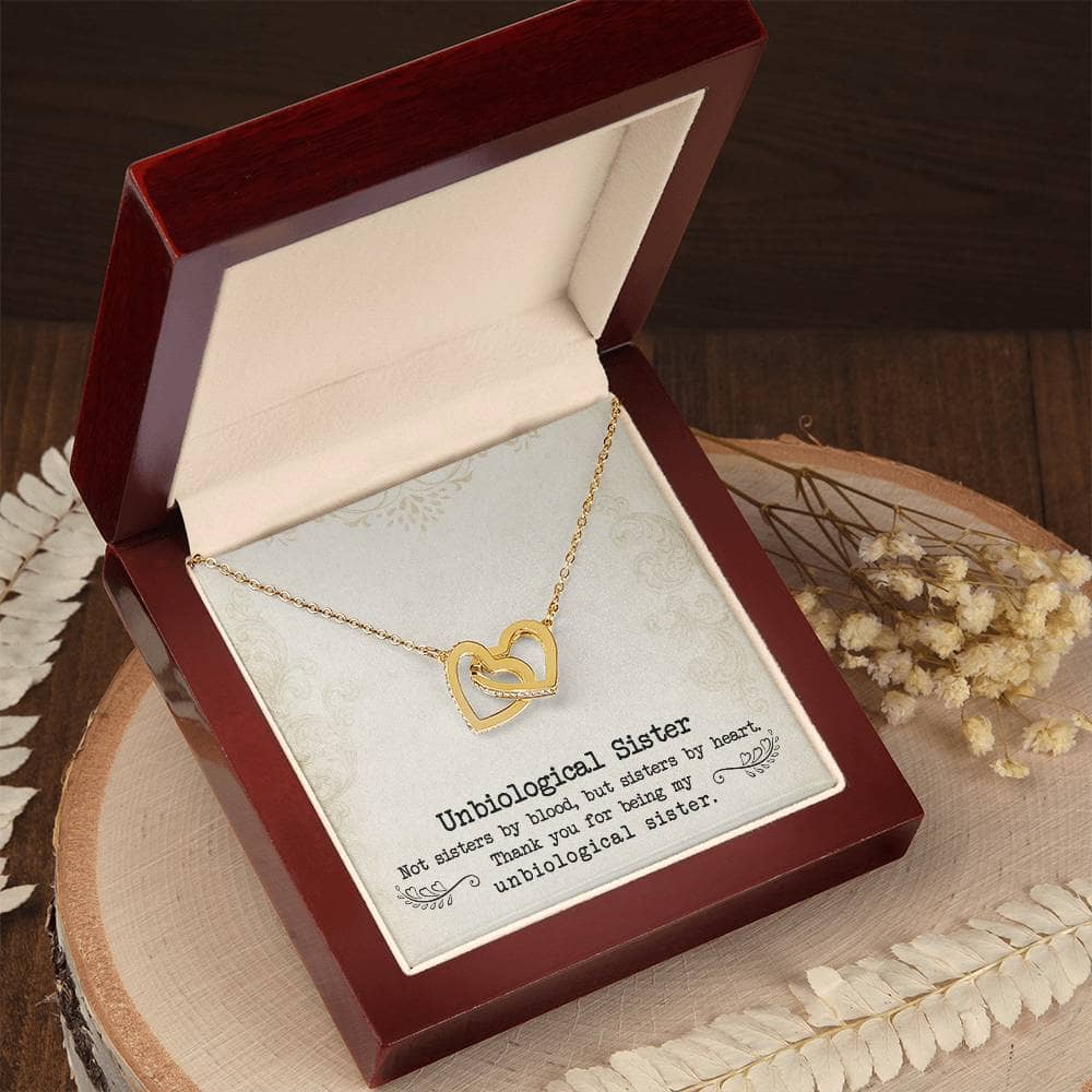 Alt text: "Custom Unbiological Sisters Necklace with Heart Pendant in a box, symbolizing eternal sisterhood and love. Shimmering 14k white gold or elegant 18k gold finish with luminescent cubic zirconia. Adjustable chains for a comfortable fit. Perfect gift for unbiological sisters. 🎁"