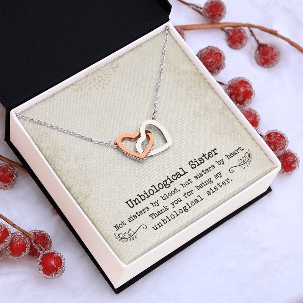 Alt text: "Custom Unbiological Sisters Necklace with Heart Pendant in a box, symbolizing eternal sisterhood and bonds. Shimmering 14k white gold or elegant 18k gold finish with luminescent cubic zirconia. Adjustable chains for a comfortable fit. A perfect tribute to unbiological sisters."