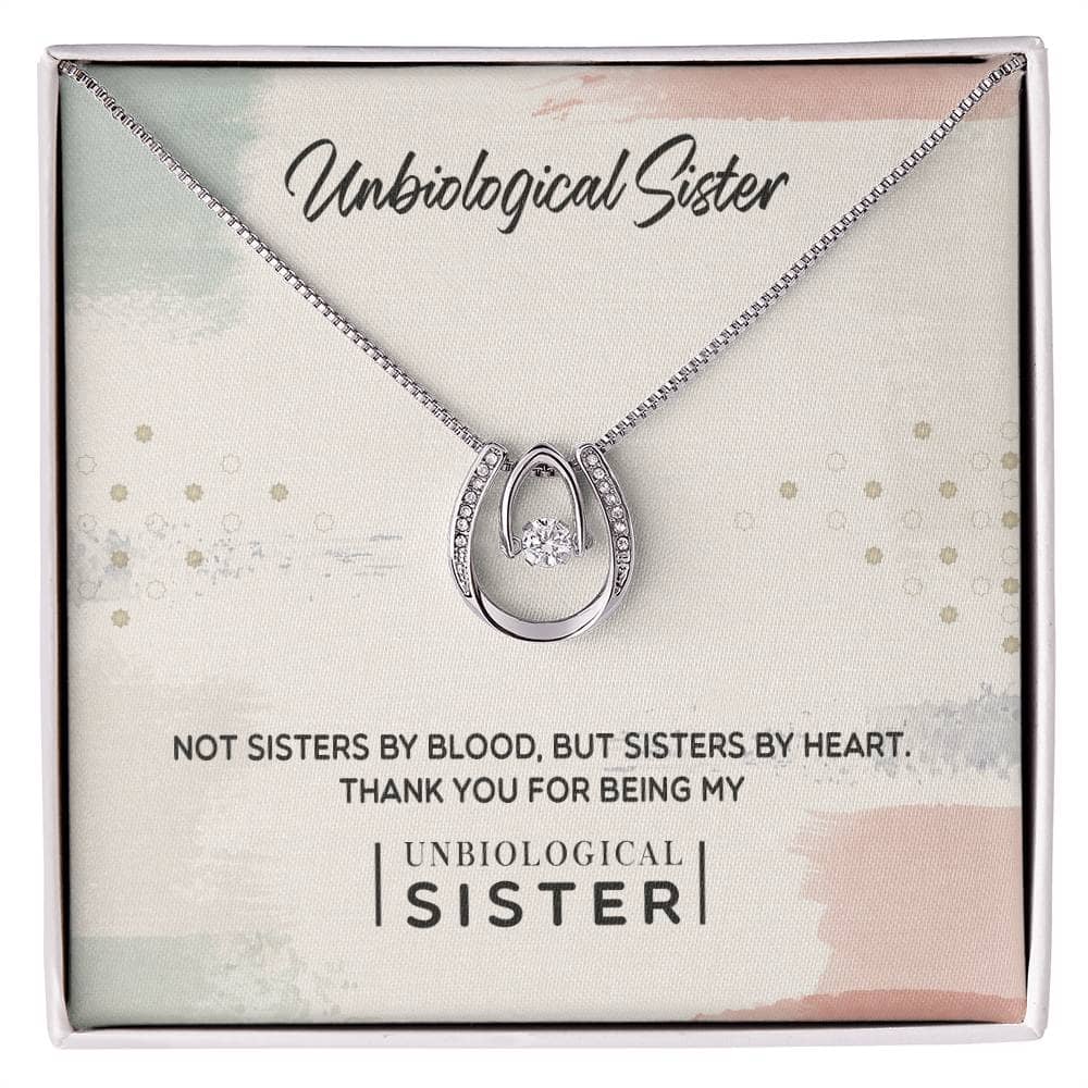 Alt text: "Custom Unbiological Sisters Necklace in elegant box, adorned with cushion-cut cubic zirconia, adjustable chain designs."