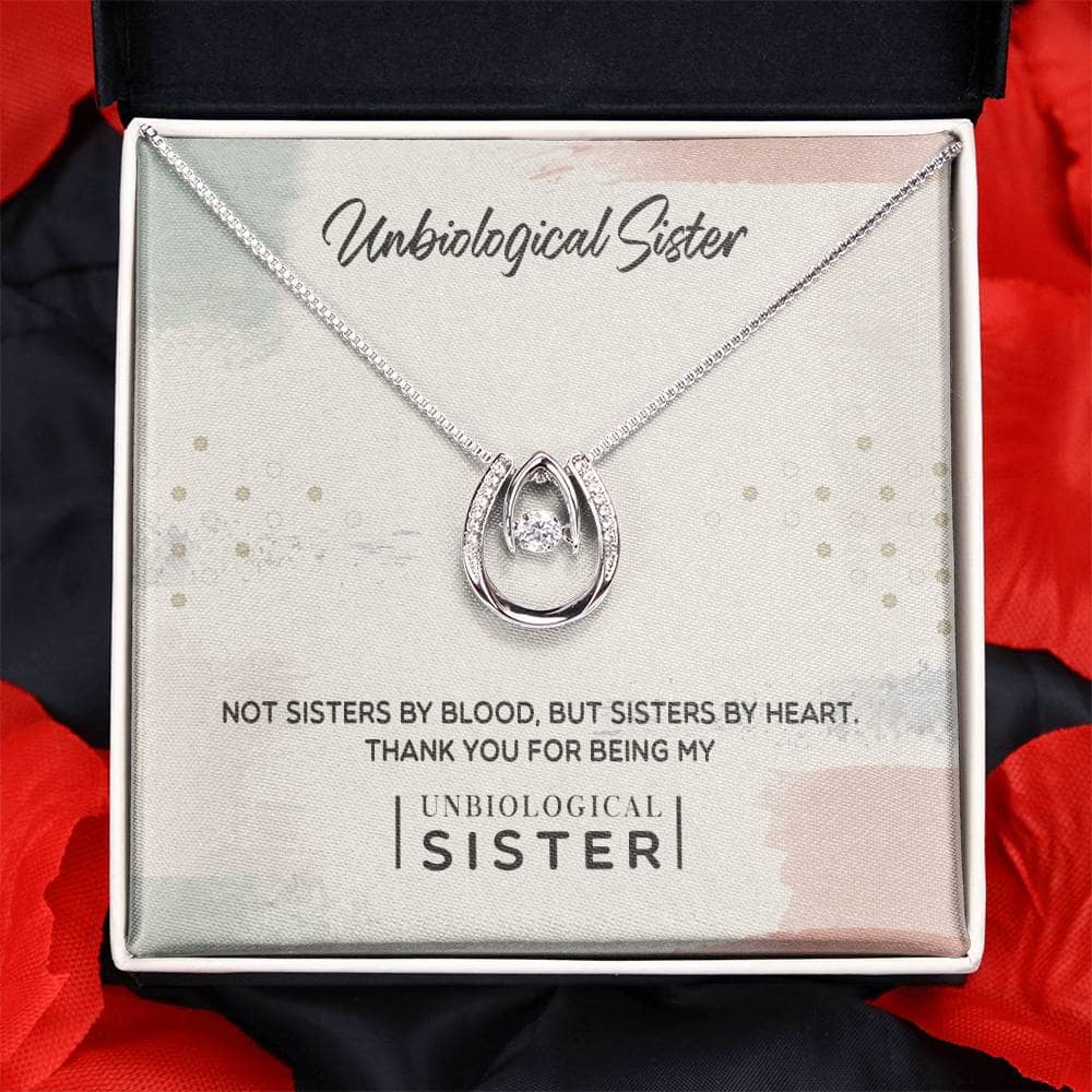 A close-up of the Custom Unbiological Sisters Necklace, featuring a sparkling cushion-cut cubic zirconia pendant. Packaged in an elegant mahogany-style box with LED lighting, it's a heartfelt gift symbolizing the special bond between unbiological sisters.