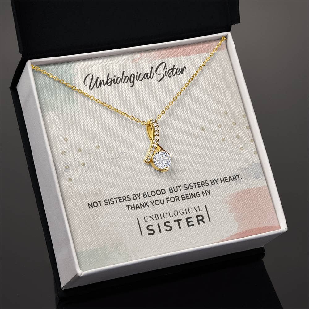 A gold necklace in a box, featuring a radiant cubic zirconia cushion-cut pendant. Symbolizing the bond between sisters-from-different-mothers, this customizable Unbiological Sisters Love Knot Necklace is crafted with top-tier materials and comes in a mahogany-style box with LED lighting. Perfect for birthdays, Christmas, or special milestones.