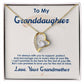 A necklace with a heart pendant in a box, symbolizing the pure love between grandparents and granddaughters.