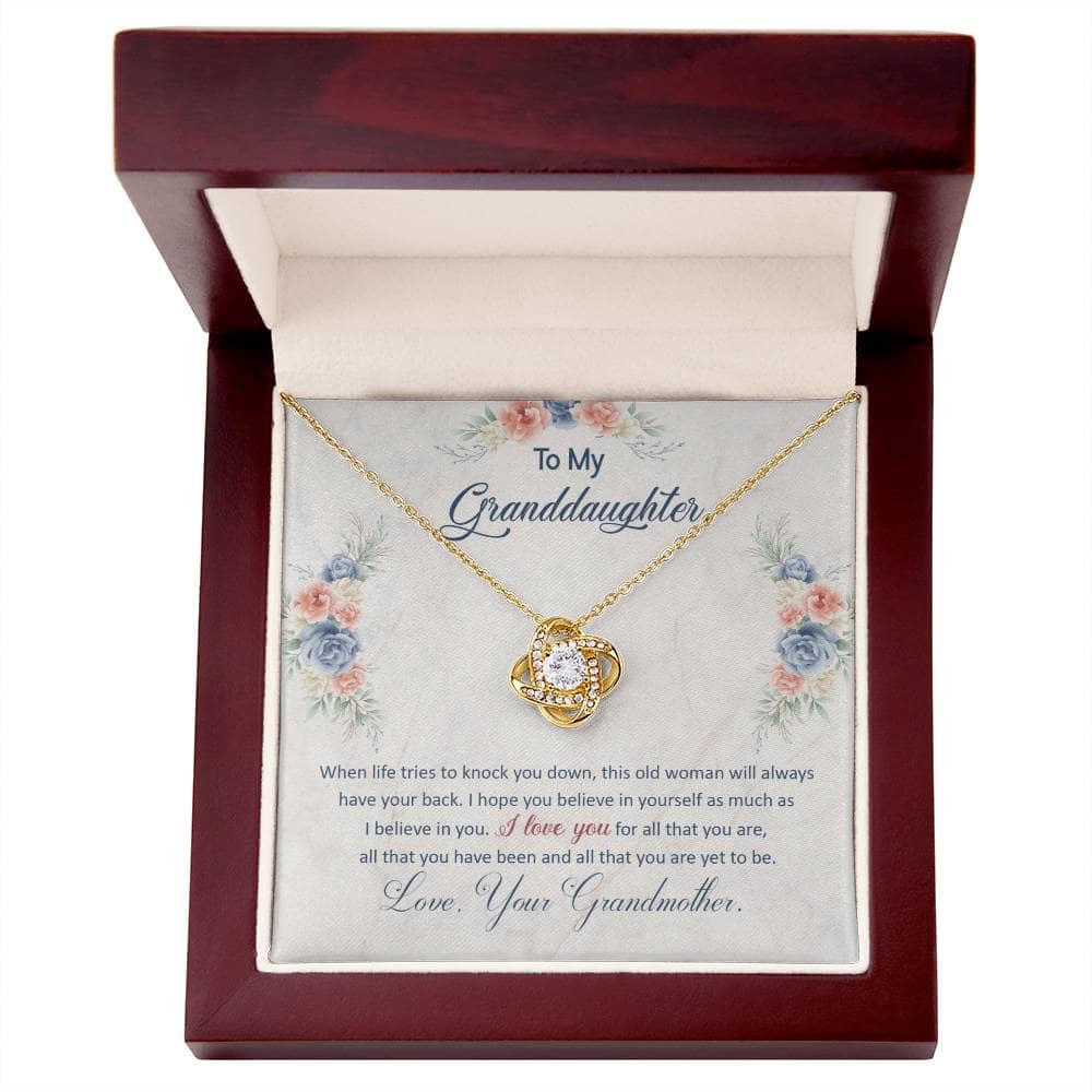 A necklace in a box, personalized for granddaughters, symbolizing the bond between generations. Adorned with heart-shaped pendants and cubic zirconia gems.