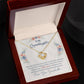Alt text: "Customized Granddaughter Love Knot Necklace in a box, adorned with heart-shaped pendants and cubic zirconia gems, symbolizing the bond between a grandmother and granddaughter."