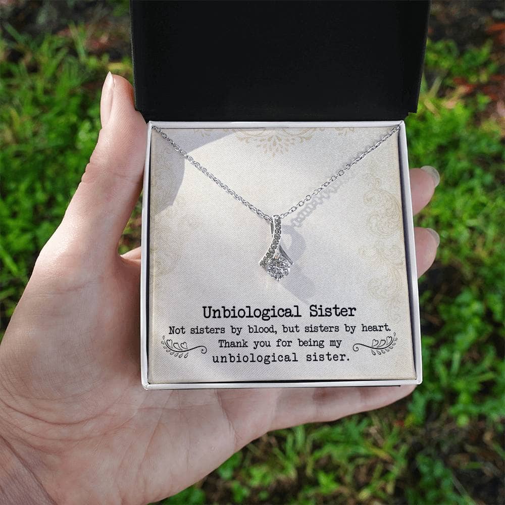 Alt text: "Customized Unbiological Sisters Necklace in box, symbolizing enduring bond, 14k white gold or 18k gold finish, cubic zirconia pendant, adjustable chains, elegant packaging"