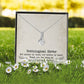 Alt text: "Customized Unbiological Sisters Necklace in a box with flowers"