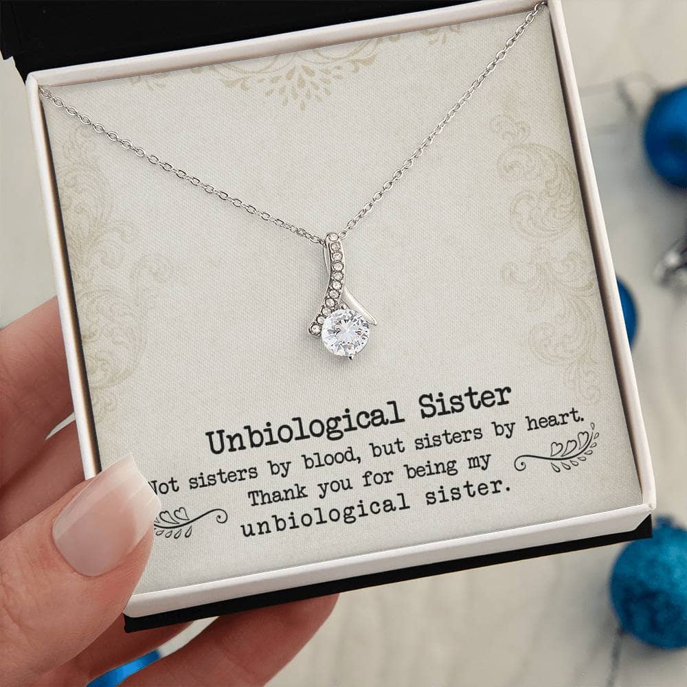 A hand holding a Customized Necklace for Unbiological Sisters, symbolizing the enduring bond between sisters.