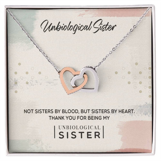 Alt text: "Customized Unbiological Sisters Heart-Link Necklace in a box, adorned with cubic zirconia, symbolizing sisterly love and bond."