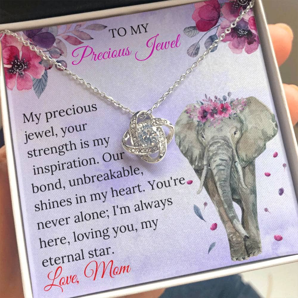 Alt text: "A hand holding the Elegant Personalized Daughter Necklace: For My Precious Jewel, adorned with cubic zirconia, symbolizing an everlasting bond between parent and daughter."