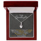 An elegant personalized granddaughter necklace with a heart pendant, beautifully packaged in a mahogany-style box.