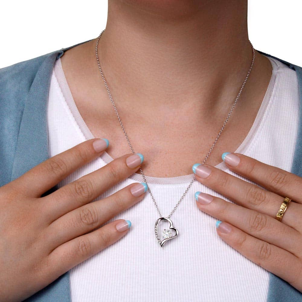 A woman wearing an elegant personalized wife necklace with a heart pendant and adjustable chain.