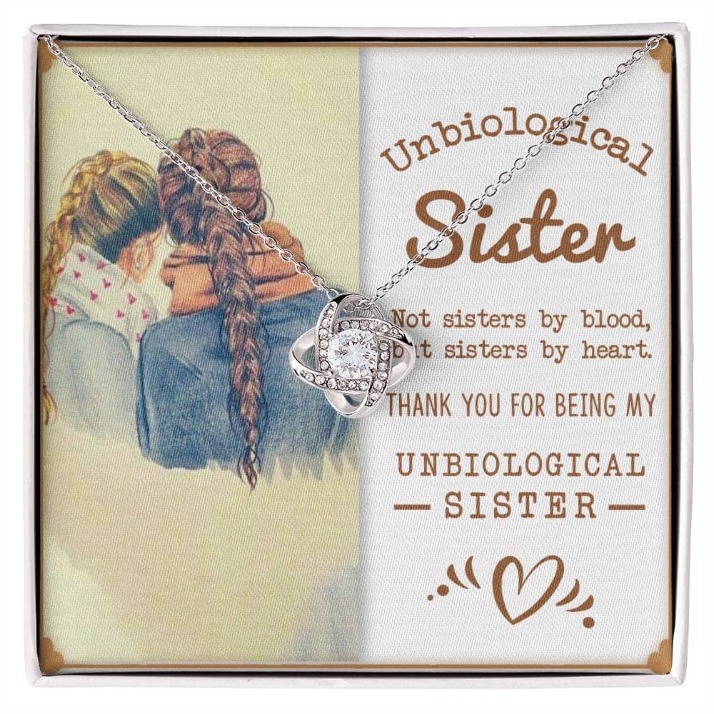 Alt text: "Entwined Hearts Charm necklace with picture of two girls, symbolizing the bond of unbiological sisters."