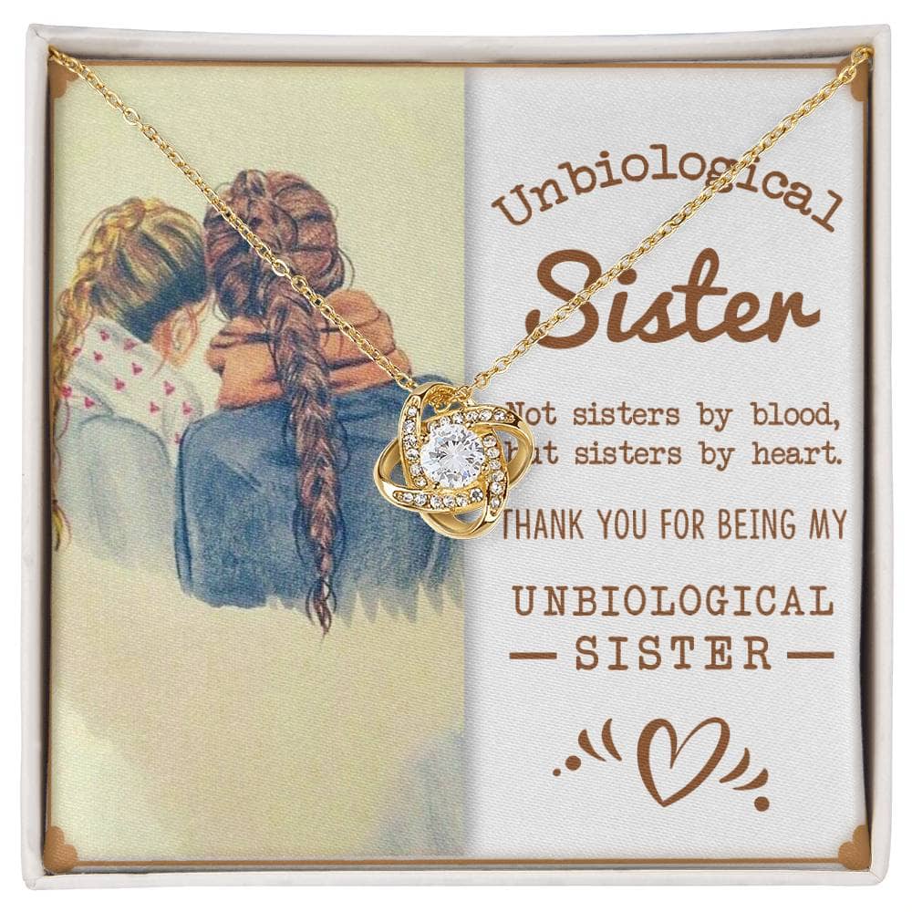Alt text: "Personalized Unbiological Sisters Necklace with intertwined hearts, adorned with a diamond, symbolizing the bond between two women hugging."
