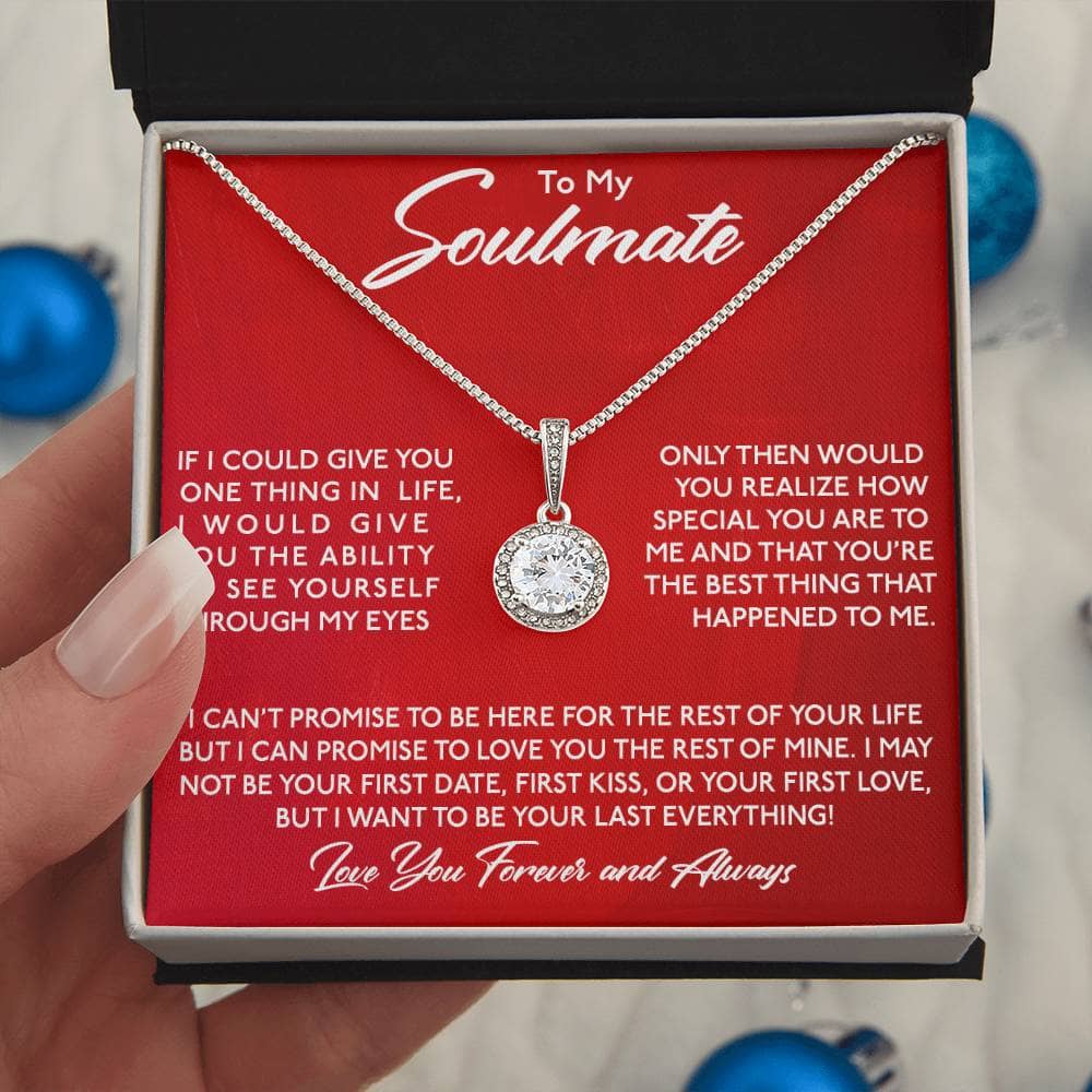 Alt text: "Hand holding Personalized Soulmate Necklace in box"
