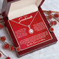 Alt text: "Personalized Soulmate Necklace in a box with red berries"
