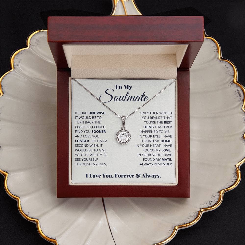 Alt text: "Eternal Hope Necklace: Heart-shaped pendant with cushion-cut cubic zirconia in a mahogany-style box with LED lighting."