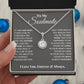 A hand holding the Eternal Hope Necklace: Love Discovered in Your Heart, For My Soulmate, in a box.