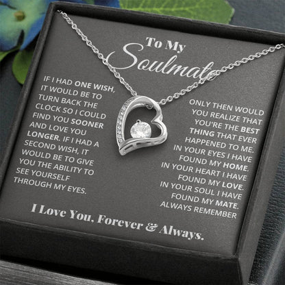 Alt text: "Forever Love Necklace - a heart pendant necklace with a 6.5mm CZ crystal centerpiece, adorned with tiny crystals, in a box"
