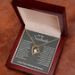 Alt text: "Eternal Love Necklace - A heart pendant with a CZ crystal centerpiece, adorned with tiny crystals, on a flexible chain. Wrapped in a soft touch box."