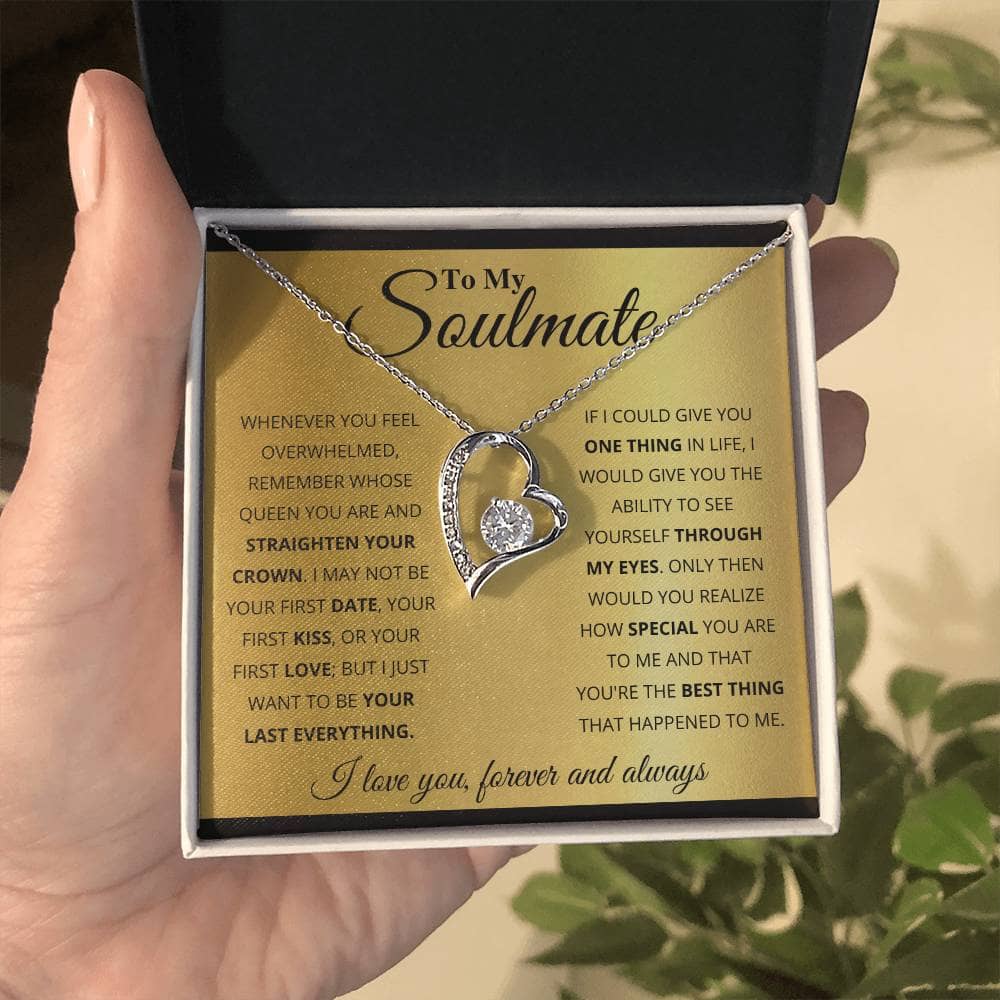 Alt text: "A hand holding the Forever Love Customized Soulmate Necklace in a box, symbolizing eternal love and affection."